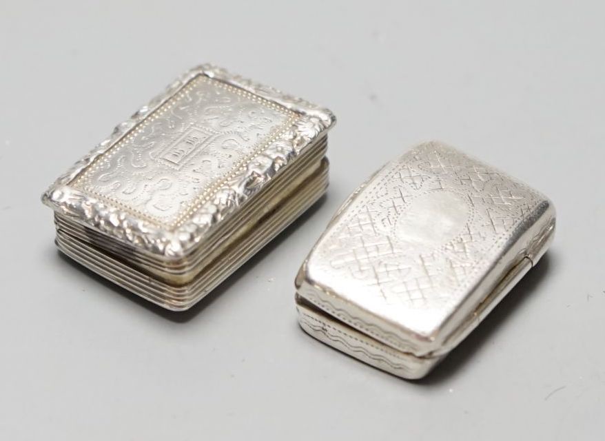 A Victorian engraved silver rectangular vinaigrette, with wriggle work decoration, William Simpson, Birmingham, 1838, 25mm and one other silver vinaigrette, Birmingham, 1820.